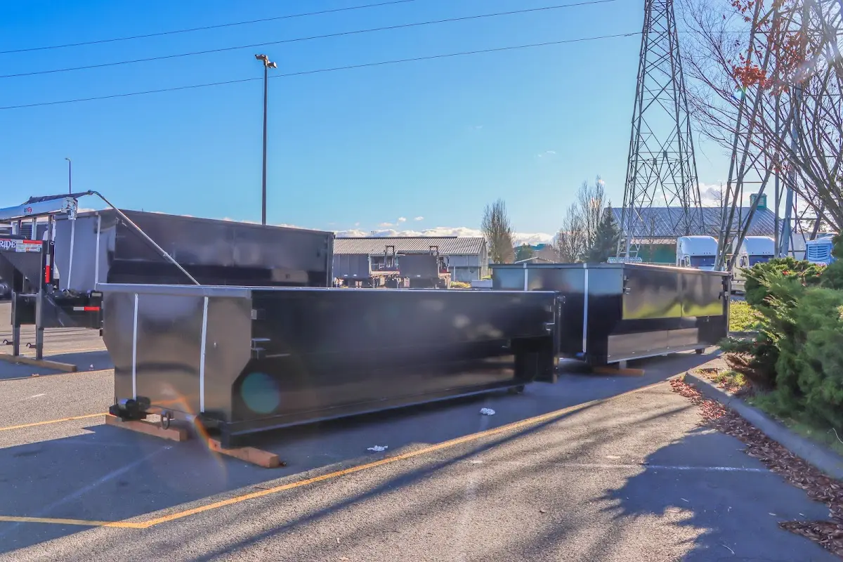Roll-off dumpster ready for waste disposal at job site for Demolition Dumpster Rental in Atlantic Beach
